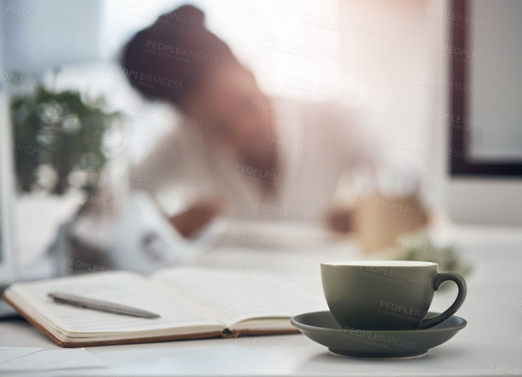 Buy stock photo Shot of a young businesswoman working at her desk