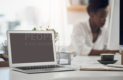 Buy stock photo Shot of a young businesswoman working at her desk