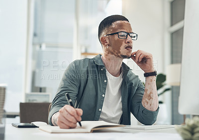 Buy stock photo Shot of a young business man working in a modern office