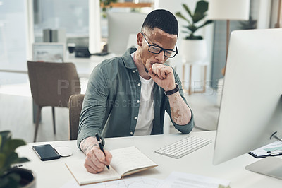 Buy stock photo Shot of a young business man working in a modern office