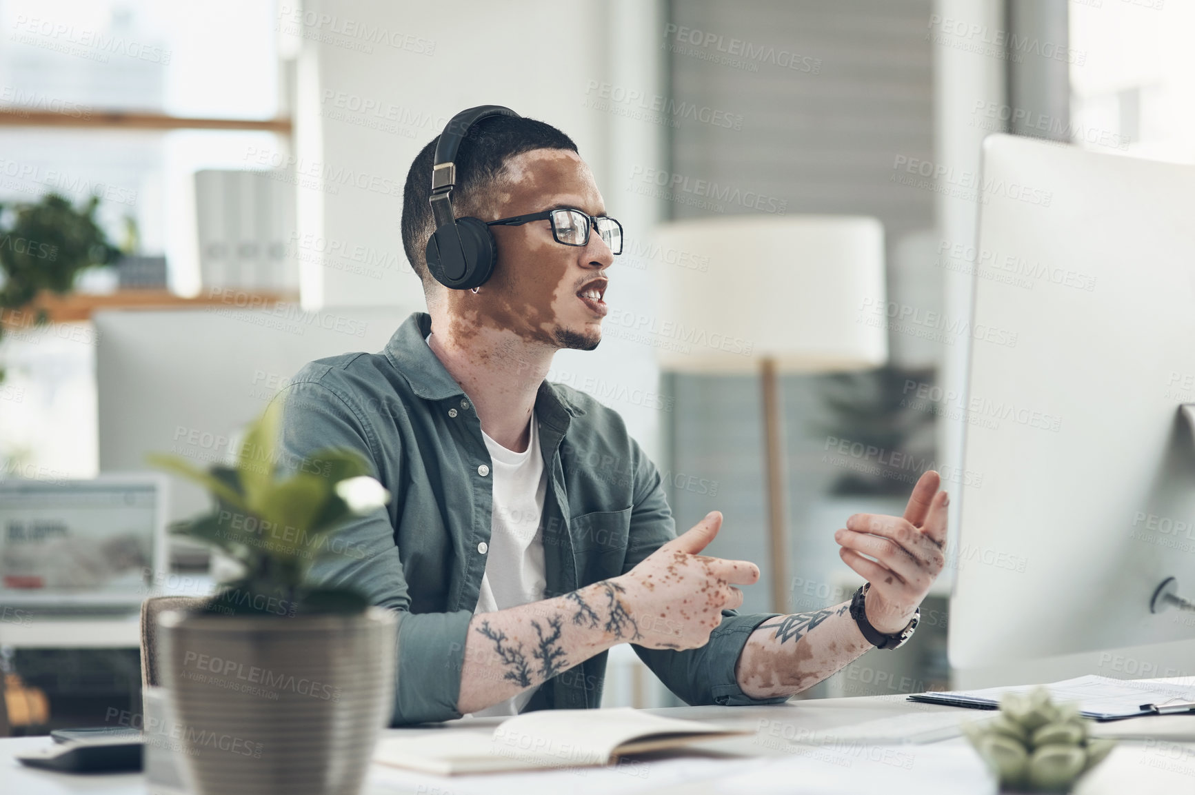 Buy stock photo Shot of a young business busy with a video call at work