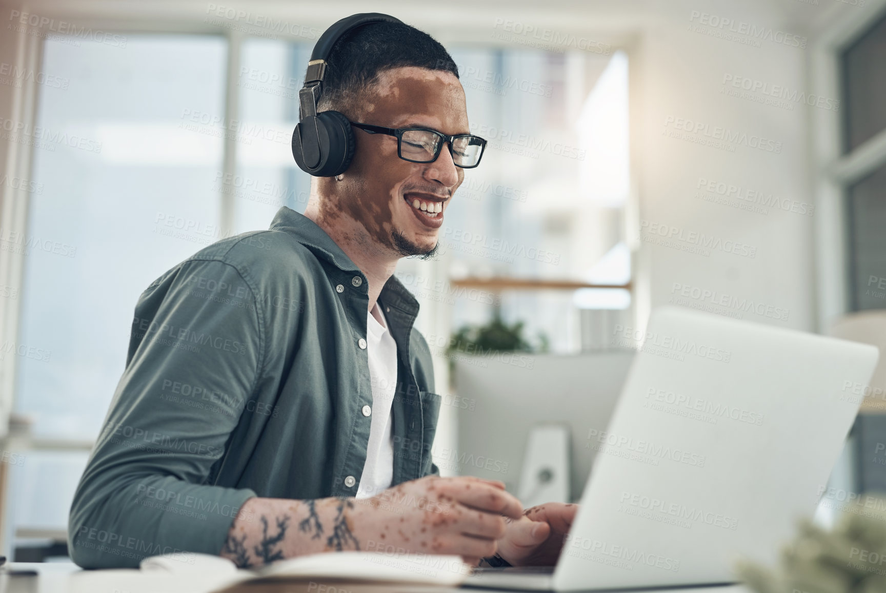 Buy stock photo Shot of a young business busy with a video call at work