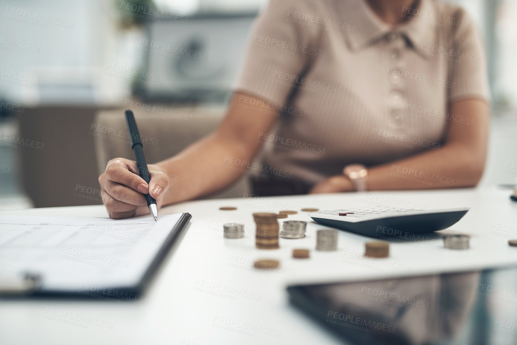 Buy stock photo Closeup shot of an unrecognisable businesswoman calculating finances in an office