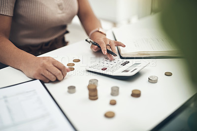 Buy stock photo Closeup shot of an unrecognisable businesswoman calculating finances in an office