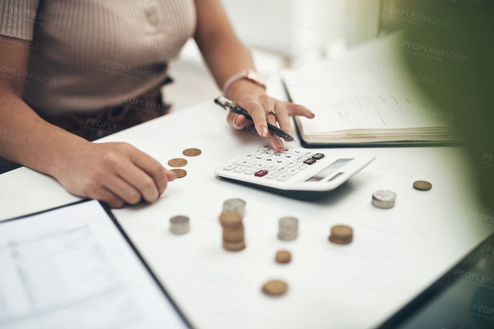 Buy stock photo Closeup shot of an unrecognisable businesswoman calculating finances in an office