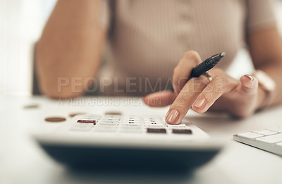 Buy stock photo Closeup shot of an unrecognisable businesswoman calculating finances in an office
