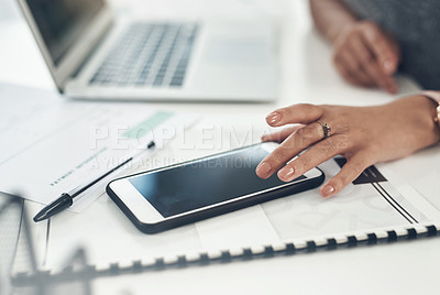 Buy stock photo Business woman, marketing analyst and entrepreneur browsing, texting and planning on a phone with a blank screen while working in an office. Closeup of a manager checking online notifications at work