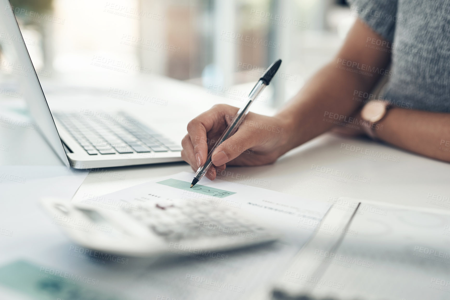 Buy stock photo Closeup shot of an unrecognisable businesswoman calculating finances in an office