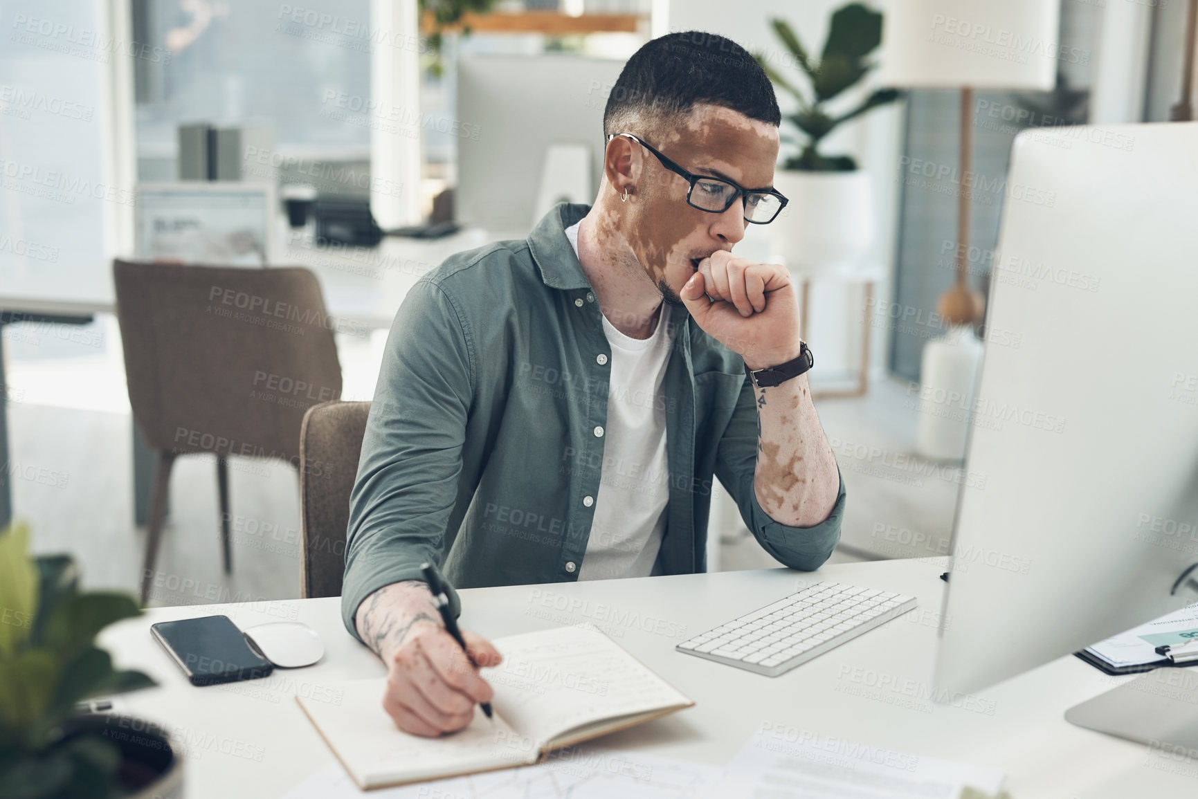 Buy stock photo Shot of a young business man working in a modern office