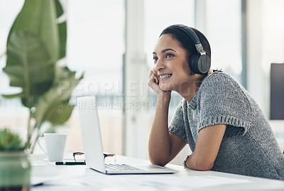 Buy stock photo Happy, smiling business woman day dreaming of success at her office desk in a modern office. Female office worker enjoying a podcast or songs during a break in a corporate company over copy space.