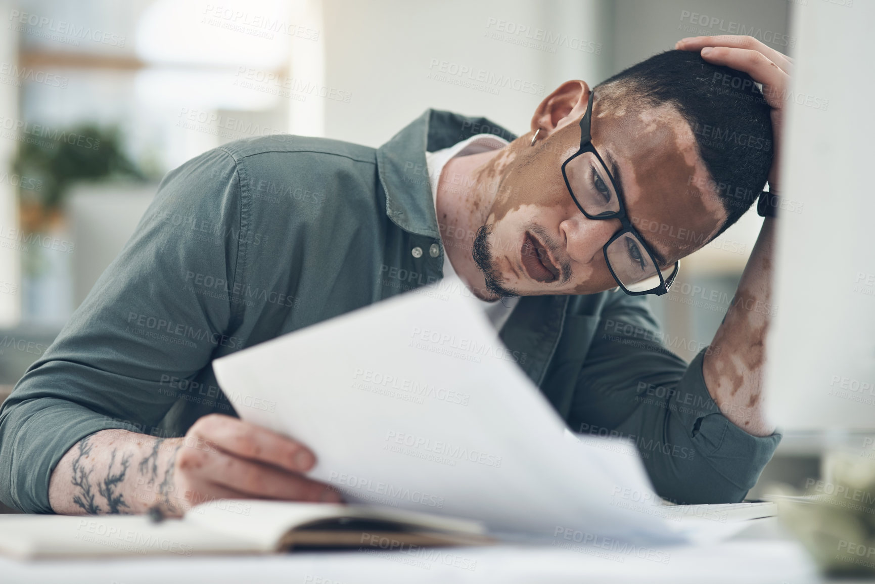 Buy stock photo Shot of a young business man working in a modern office