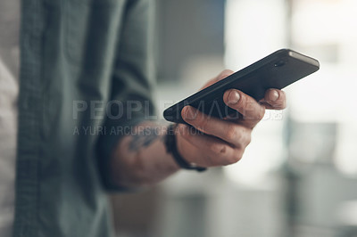 Buy stock photo Shot of a unrecognizable business man using a tablet at work