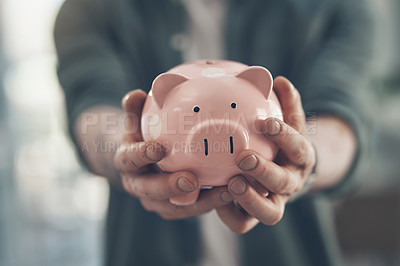 Buy stock photo Shot of an unrecognizable man holding a piggy bank