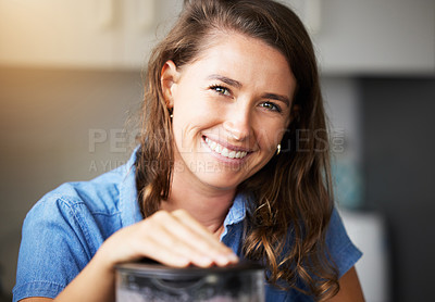 Buy stock photo Shot of a young female preparing a meal at home