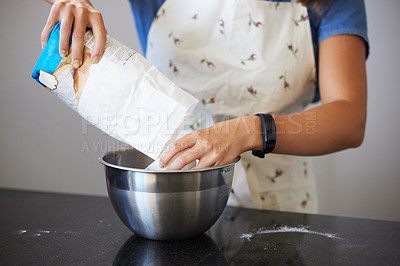 Buy stock photo Shot of a unrecognizable female baking in the kitchen  at home