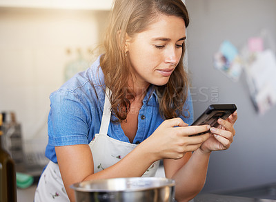 Buy stock photo Shot of a young female preparing a meal at home