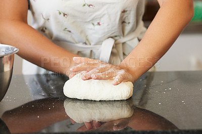 Buy stock photo Shot of a unrecognizable female baking in the kitchen  at home