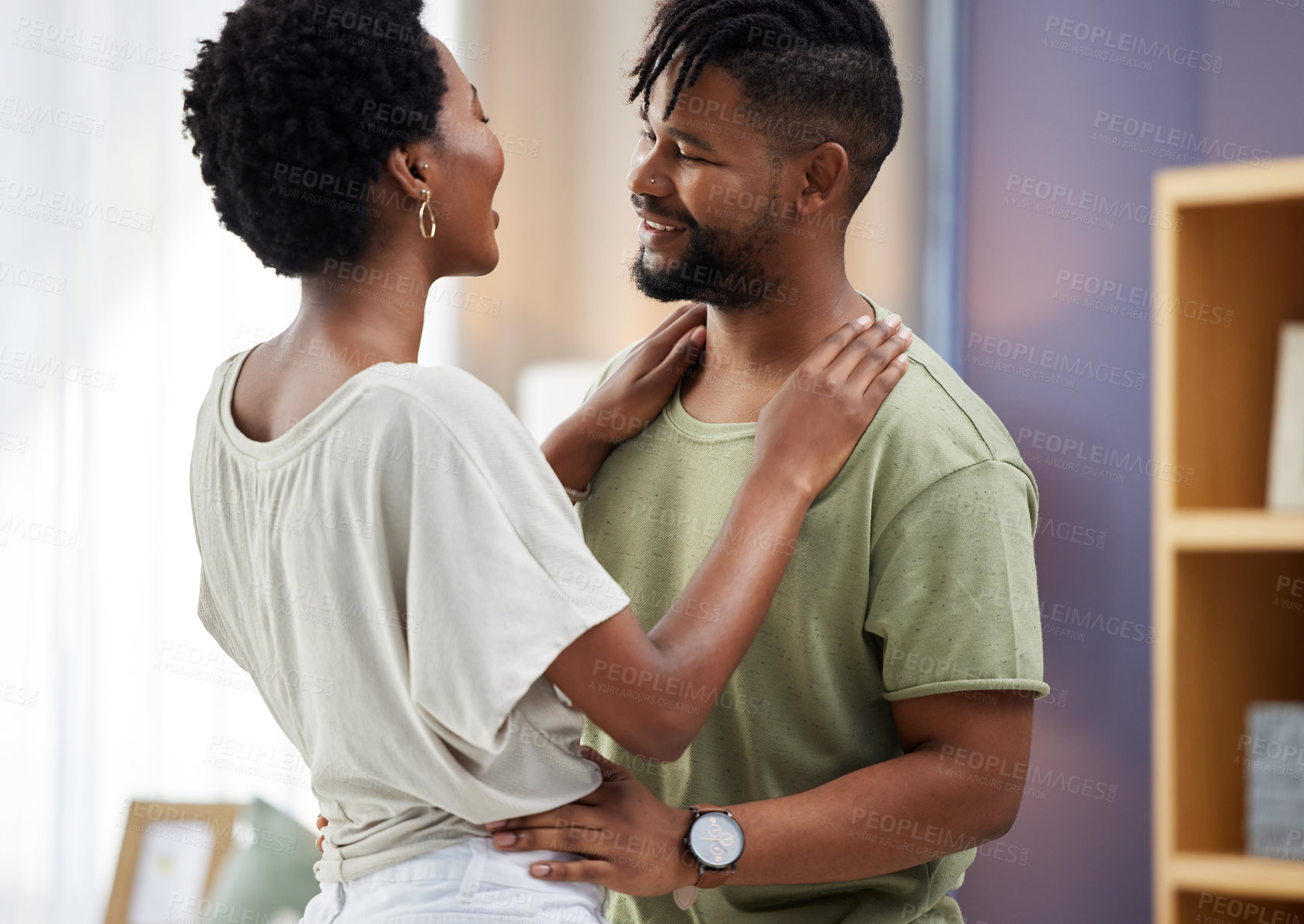 Buy stock photo Black couple, dancing and hug in living room happy and in love for relationship, romance or commitment. Smiling, man and woman embrace in home together for relaxing, dating fun and bonding on weekend