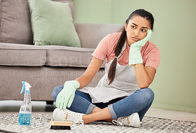 Buy stock photo Thinking, tired and woman in lounge, cleaning and tools for housework, brush and spray bottle of disinfectant. House, living room and girl on floor, daydreaming and bored of dust and chores in home