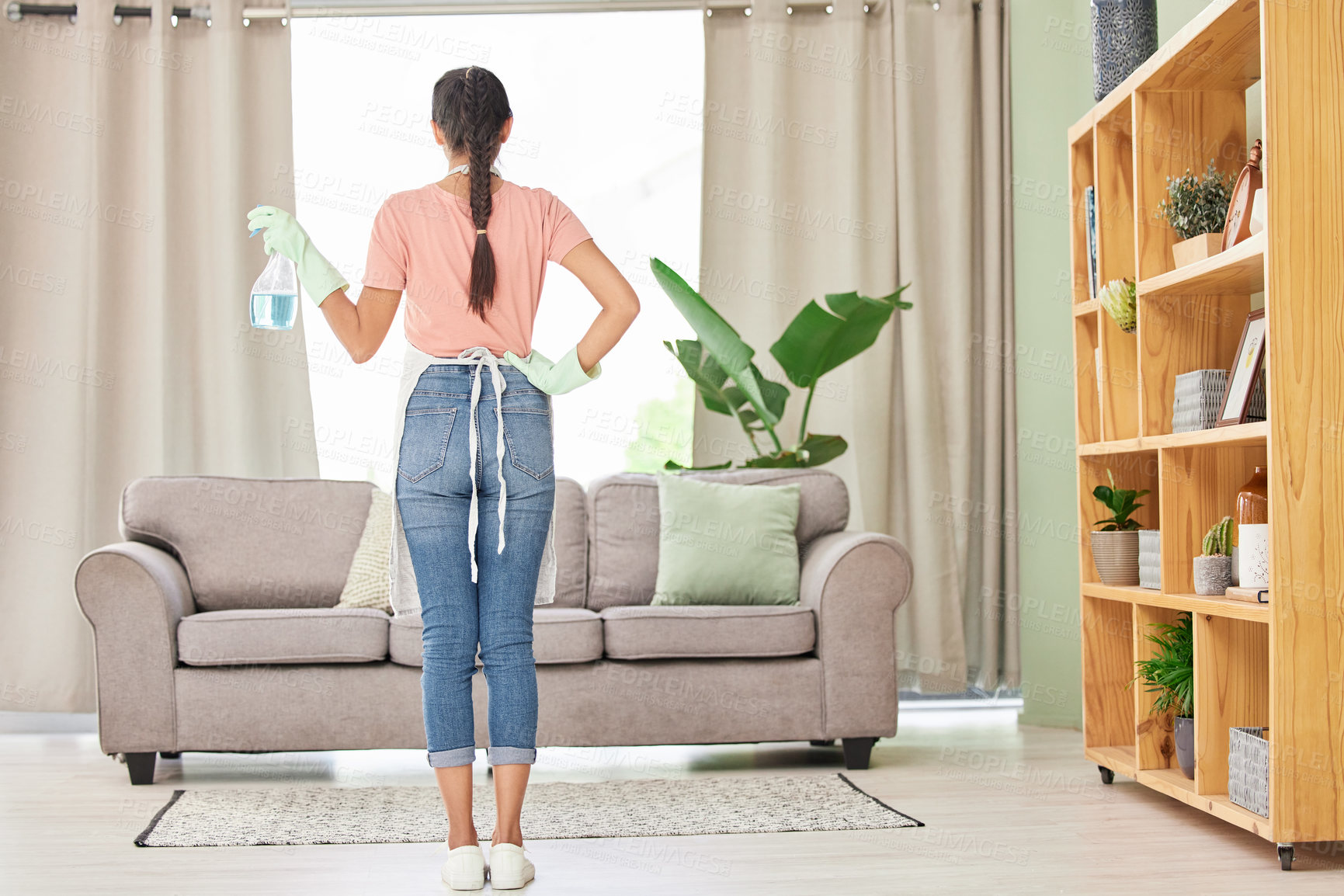 Buy stock photo Woman, spray and bottle for cleaning at home with apron or gloves for protection of detergent in living room. Housekeeping service, product and safety of disinfection for risk of bacteria or germs 