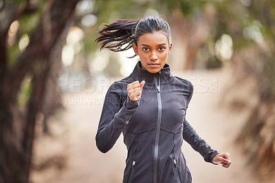 Buy stock photo Portrait, runner and Indian woman in nature for fitness, performance workout or outdoor training. Serious, health and female athlete running for cardio endurance, speed exercise or marathon in park