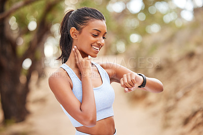 Buy stock photo Fitness, running and woman checking her pulse while training for a race, competition or marathon. Sports, exercise and female athlete runner with time and heart rate during an outdoor cardio workout.
