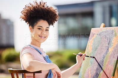 Buy stock photo Cropped portrait of an attractive young woman painting in the park