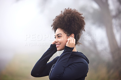 Buy stock photo Girl, runner and earphones in morning fog in nature for health, fitness or vision for wellness. Woman, person and athlete in workout, training or listen to music with idea, smile and winter in Canada