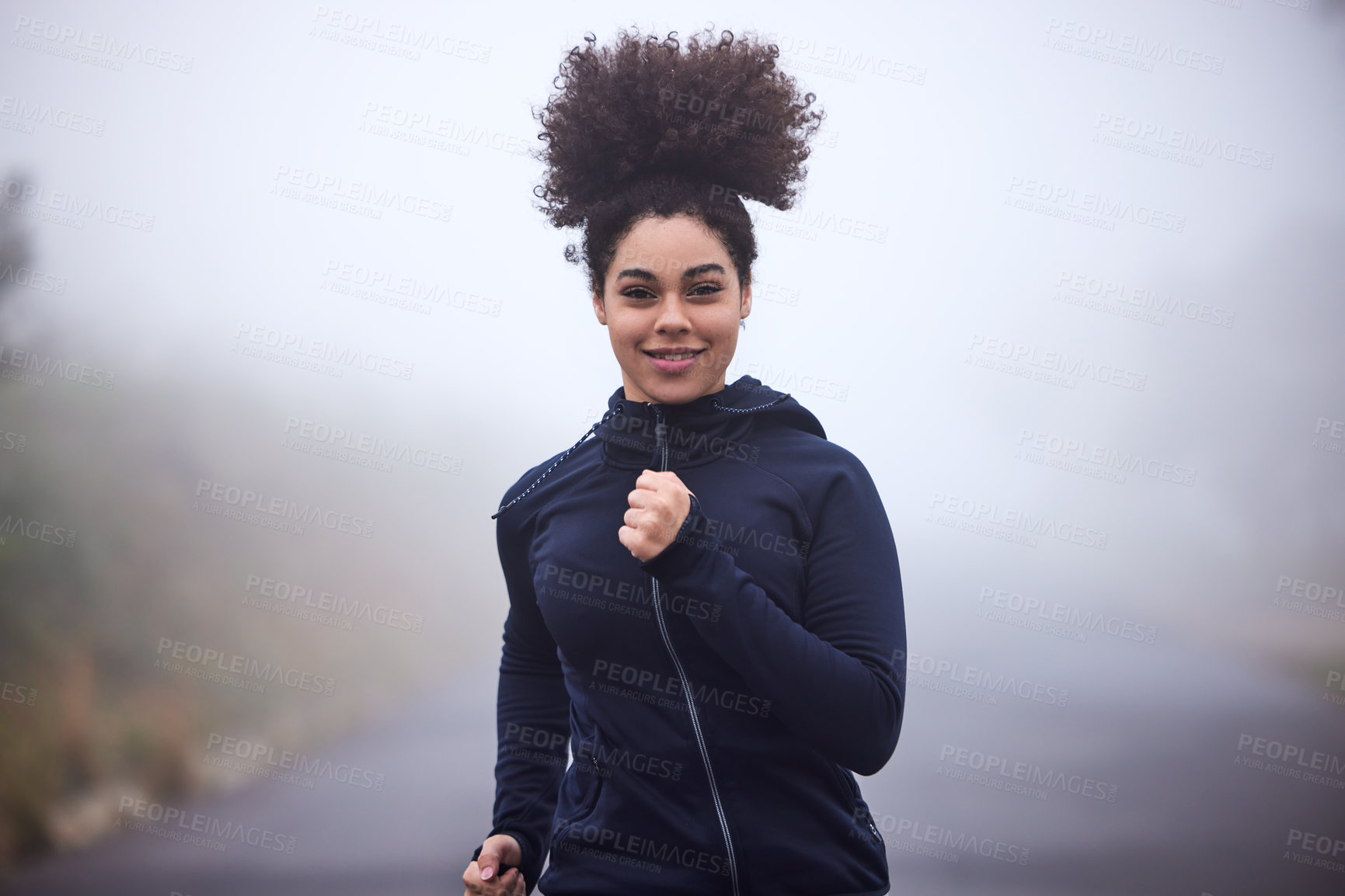 Buy stock photo Girl, running and smile in morning fog in nature for health, fitness or wellness on road in portrait. Woman, person and athlete in workout, training and outdoor for speed, cardio and winter in Canada