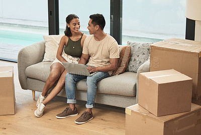 Buy stock photo Shot of a couple using a laptop at home