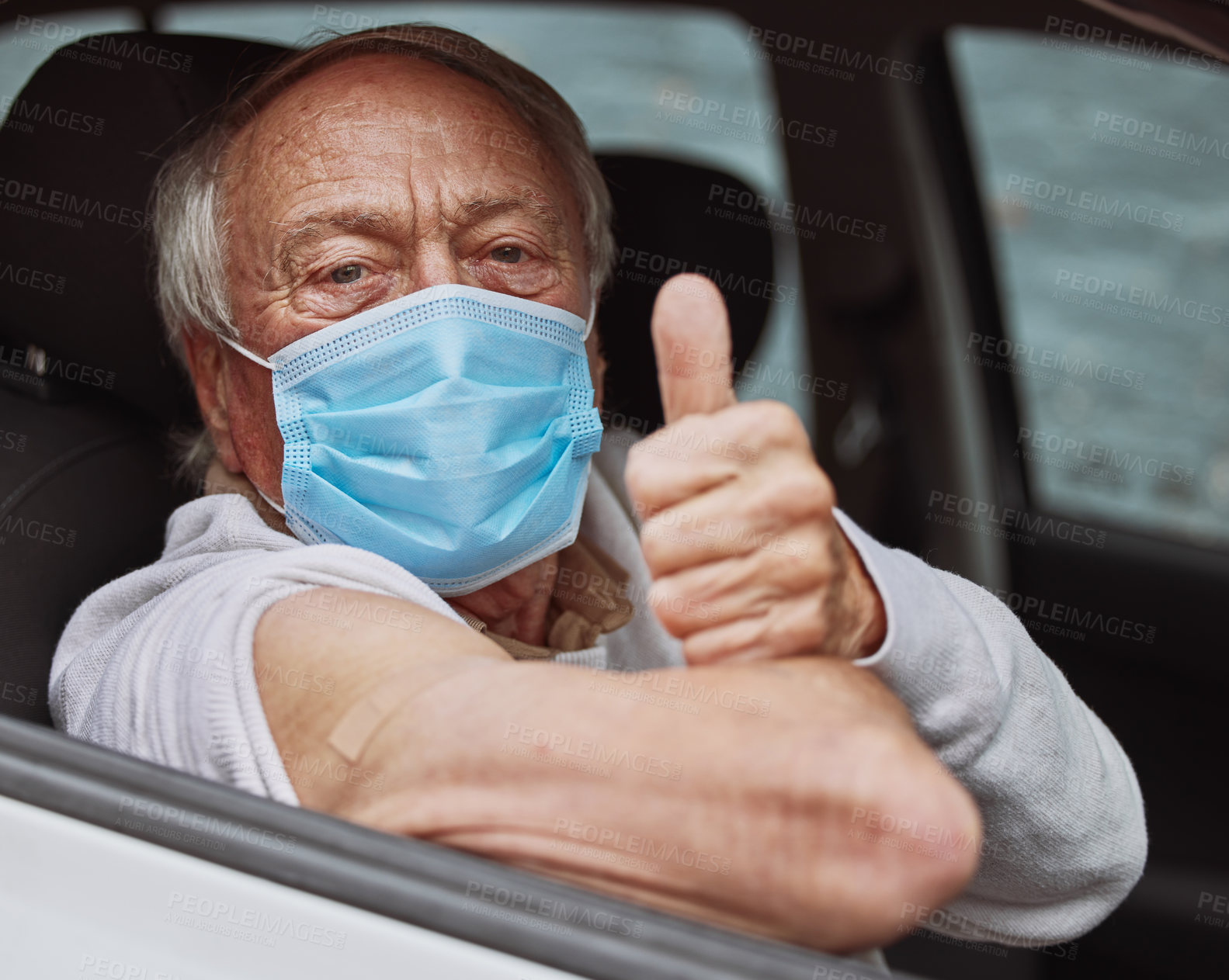 Buy stock photo Shot of a senior man showing a thumbs up in his car at a drive through vaccination site