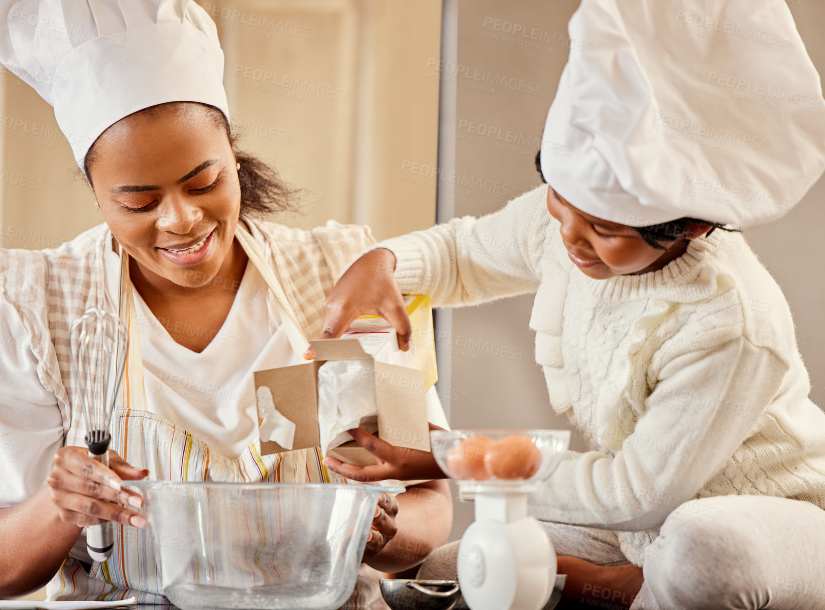 Buy stock photo Baking, bowl and black woman in kitchen with child mixing flour, eggs or ingredients for cake in home. Family, cooking and mother teaching girl to bake for development, learning or bonding together