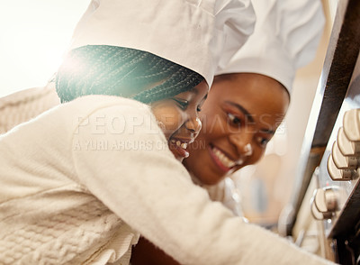 Buy stock photo Black mother, child and oven in kitchen with baking class, lens flare and learning to cook food. African mom, young kid and helping in house for family recipe, cooking tutorial and happy with smile
