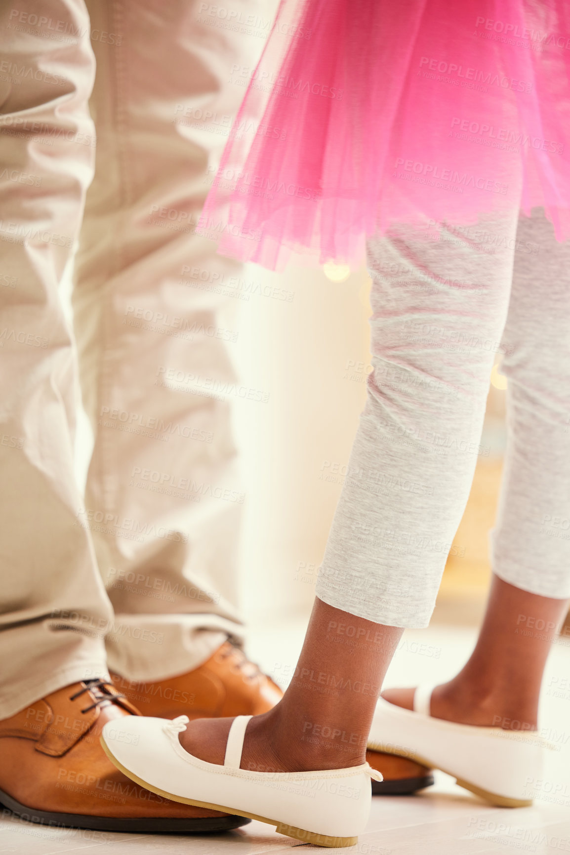 Buy stock photo Shot of a unrecognizable girl dancing on her father's feet at home
