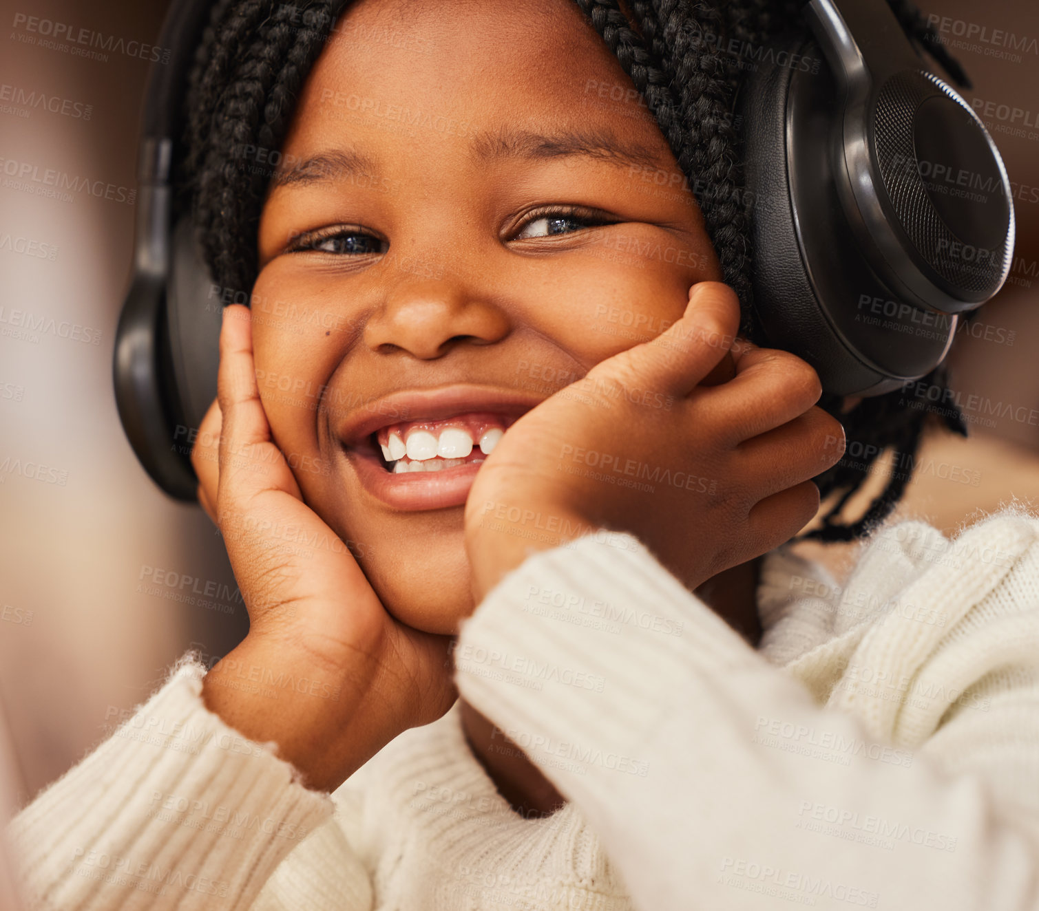 Buy stock photo Shot of a little girl wearing headphones at home