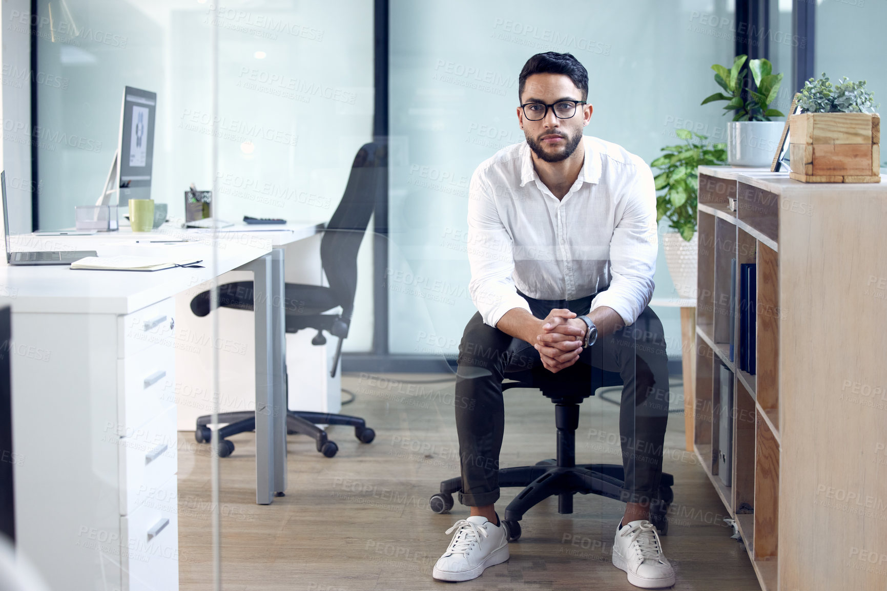 Buy stock photo Portrait, serious and business man in office, company and workplace of confident young male person working in Saudi Arabia. Professional consultant, employee and entrepreneur with glasses for career