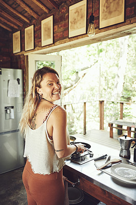 Buy stock photo Shot of a young woman preparing a meal