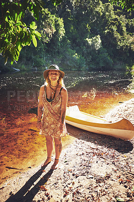 Buy stock photo Shot of a young woman out by the lake with a kayak