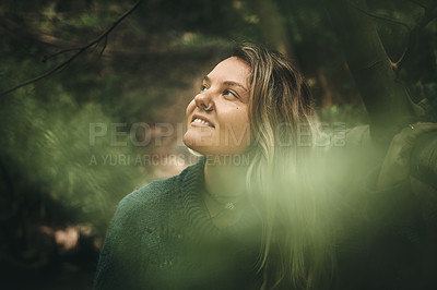 Buy stock photo Shot of a young woman out exploring nature