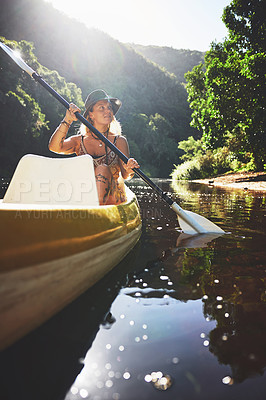 Buy stock photo Shot of a young woman out kayaking on a lake