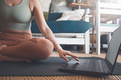 Buy stock photo Closeup shot of an unrecognisable woman using a laptop while exercising at home