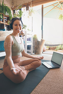 Buy stock photo Portrait of a young woman using a laptop while practising yoga at home