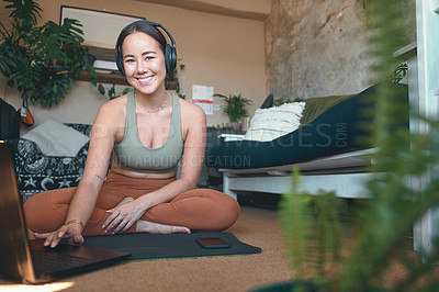 Buy stock photo Portrait of a young woman using a laptop while exercising at home