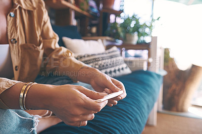 Buy stock photo Shot of an unrecognisable woman taking a pregnancy test on the sofa at home