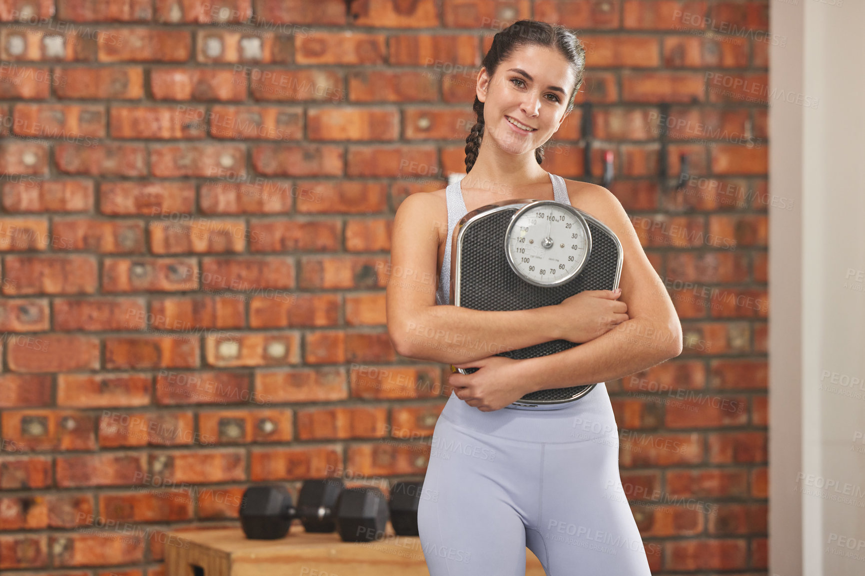 Buy stock photo Woman with scale, fitness and lose weight with exercise in gym, smile in portrait with health and mockup space. Female person in workout studio, weightloss and diet with healthy and active lifestyle