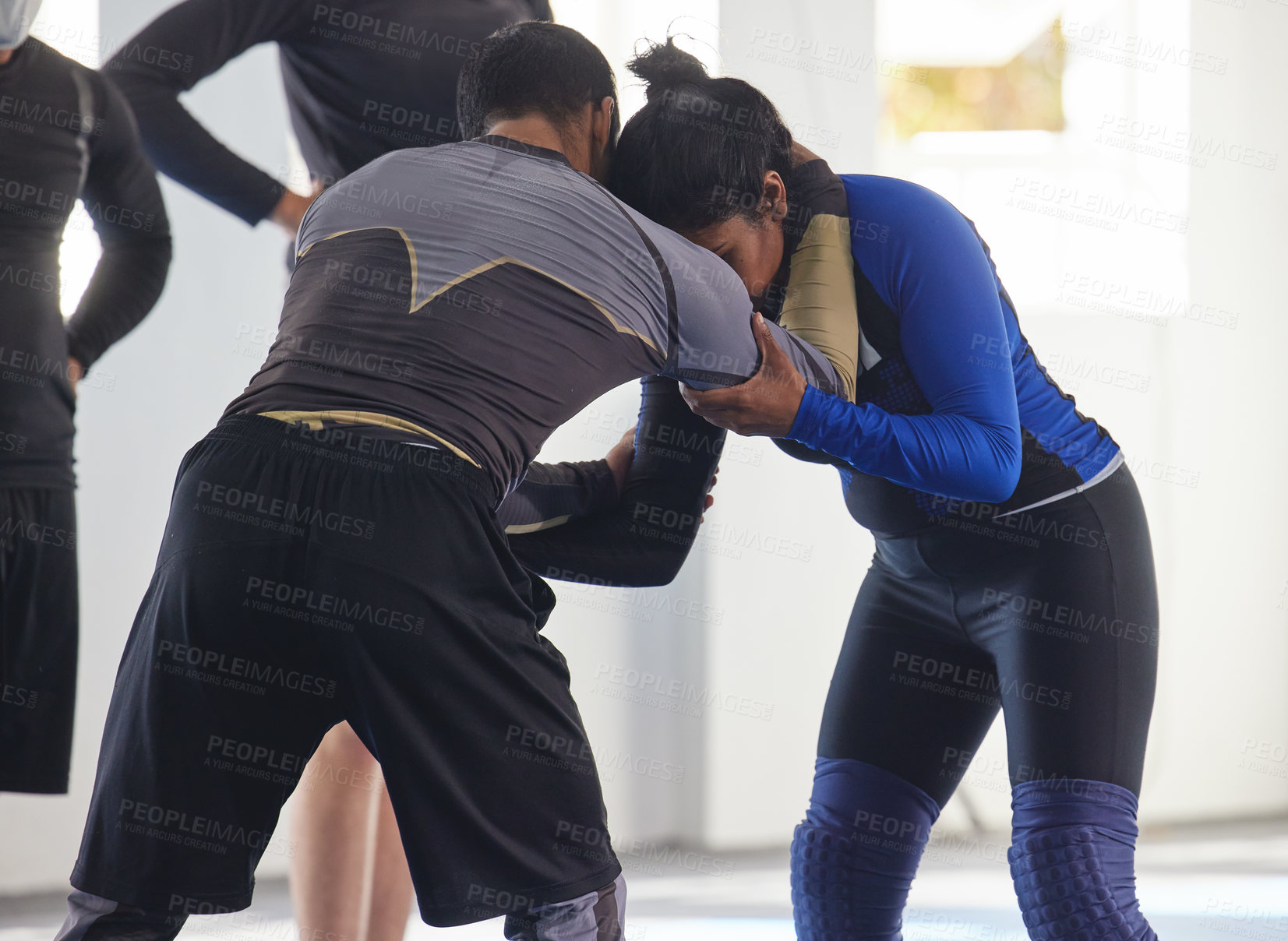 Buy stock photo Cropped shot of a jiu jitsu sensei sparring with one of his students during a class