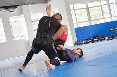 Buy stock photo Men are training, martial arts and fitness in gym with combat, jiu jitsu and students learning self defense skills. Fight, exercise and MMA with fighting sport and male people train at exercise dojo