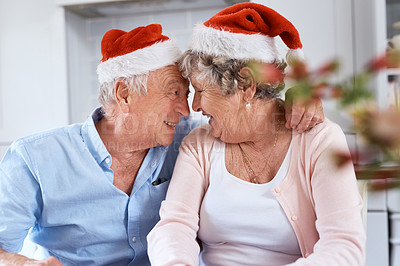 Buy stock photo Shot of an elderly couple being affectionate during a festive celebration at hoe