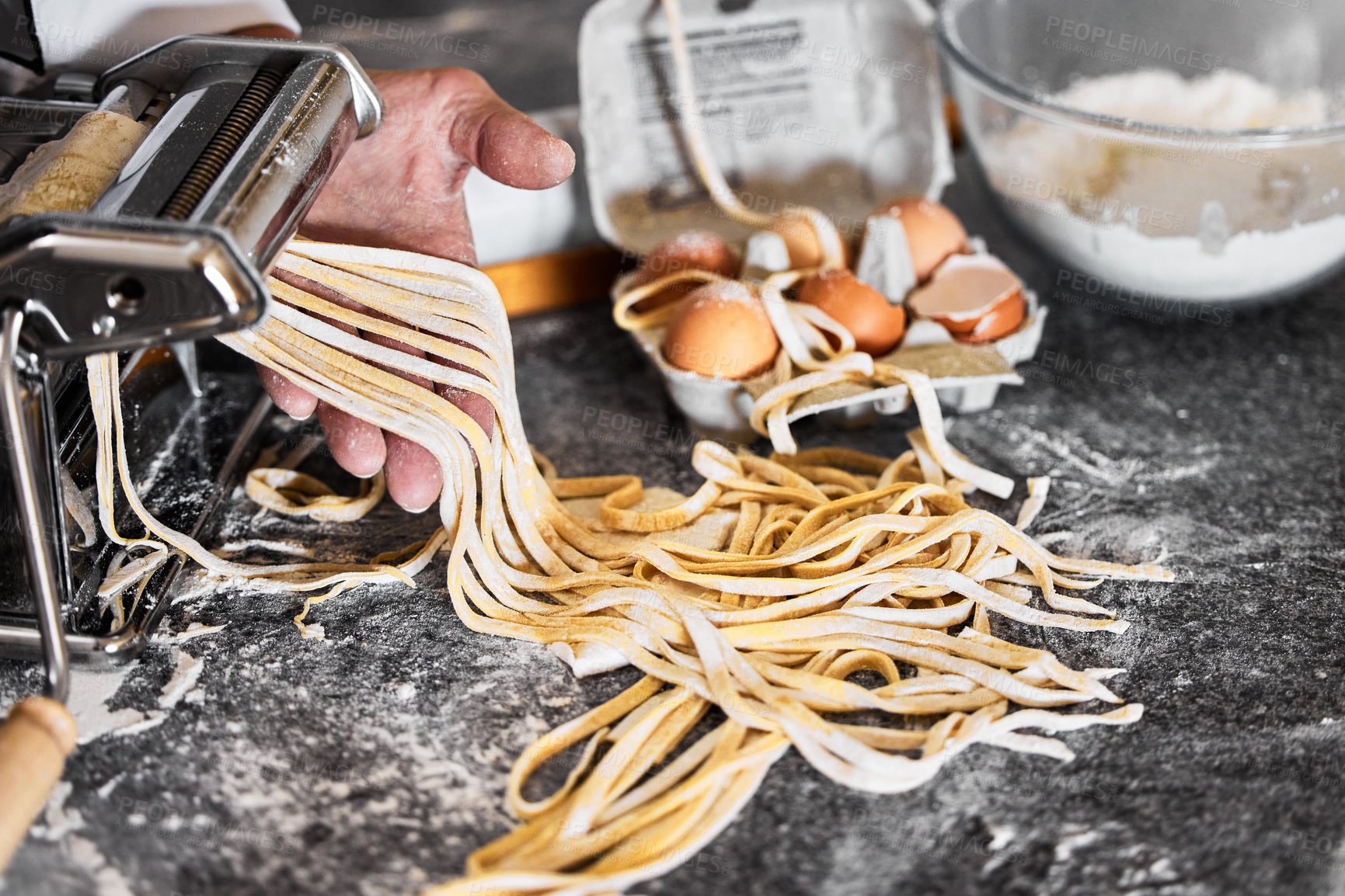 Buy stock photo Shot of an unrecognisable man preparing freshly made pasta