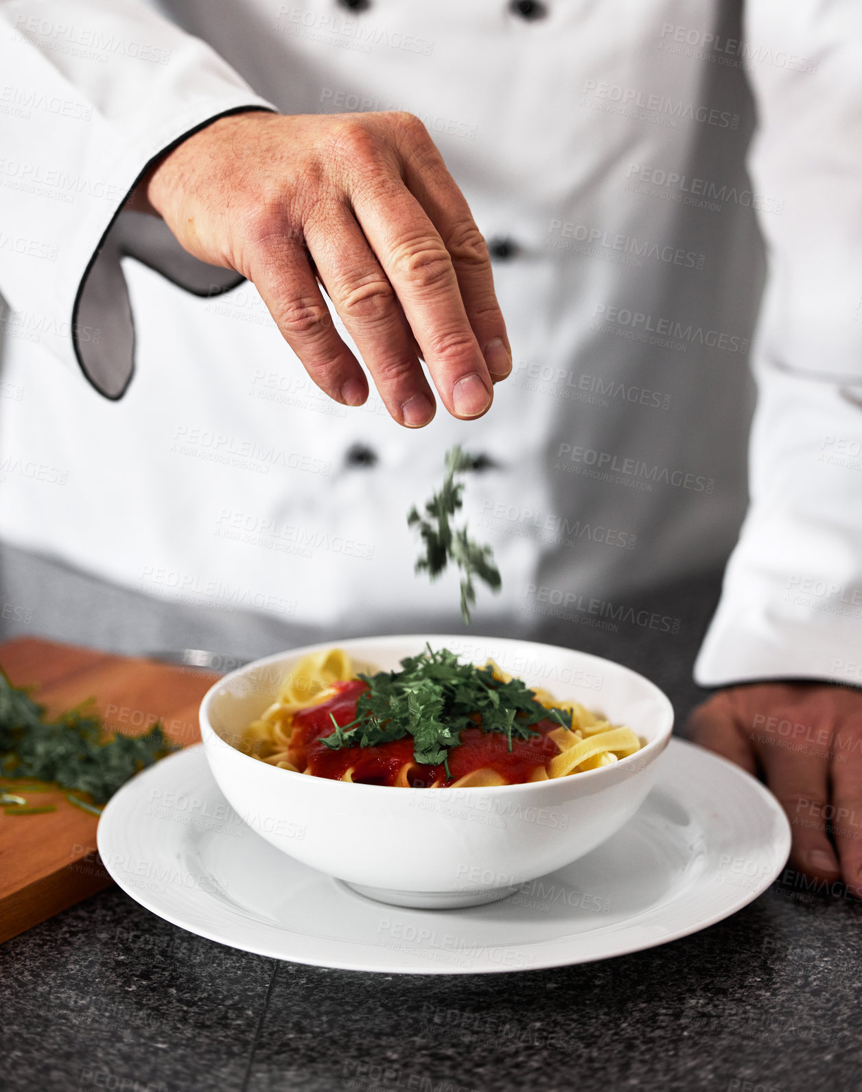 Buy stock photo Chef, hands and bowl with pasta recipe in kitchen for fine dining, serving or cooking at restaurant. Closeup of person, culinary artist or parsley on gourmet dish, Italian meal or food in hospitality